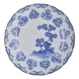 A JAPANESE ARITA BLUE AND WHITE DISH, EDO PERIOD, 18TH CENTURY circular, painted with flowering