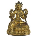 A GILT-BRONZE FIGURE OF TARA, TIBET, 16TH CENTURY seated in lalitasana on a double lotus throne, her