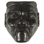 ˜A JAPANESE EBONY MASK NETSUKE OF SANKOJO, LATE MEIJI PERIOD, CIRCA 1910 signed Masayoshi 4.6cm high