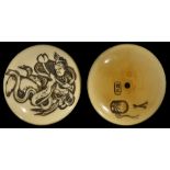 ˜A JAPANESE STAINED IVORY TWO-PART MANJU NETSUKE BY SHUYUSAI MINKOKU, EARLY MEIJI PERIOD, CIRCA 1870