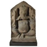 A PINK SANDSTONE STELE DEPICTING GANESHA, CENTRAL INDIA, CIRCA 10TH CENTURY the pot-bellied four