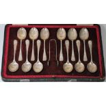A CASED SET OF TWELVE GEORGE V SILVER COFFEE SPOONS AND A PAIR OF SUGAR TONGS, COOPER BROTHERS &