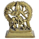 A BRASS FIGURE OF DURGA MAHISASURAMARDINI, DECCAN, SOUTHERN INDIA, 18TH CENTURYthe eight armed Hindu