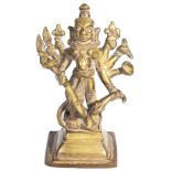 A BRASS FIGURE OF DURGA MAHISASURAMARDINI, WESTERN DECCAN, CIRCA 18TH CENTURYon tiered base, the