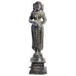 A BRONZE FIGURE OF DIPALAKSHMI, WESTERN DECCAN, INDIA, 17TH/18TH CENTURYstanding on a raised plinth,