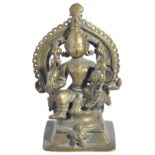 A BRASS LAKSHMI-NARAYANA, WESTERN INDIA, 16TH/17TH CENTURYthe couple seated on a stool with