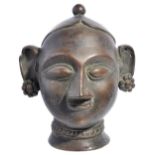 A BRONZE GAURI HEAD, WESTERN INDIA, CIRCA 18TH CENTURYwith stylised features, wearing necklace and