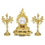 A MATCHED THREE-PIECE GILT-BRONZE CLOCK GARNITURE, FRENCH, CIRCA 1900the clock with eight-day