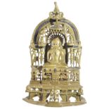 A JAIN BRASS SHRINE, GUJARAT, WESTERN INDIA, CIRCA 16TH CENTURYdepicting a seated tirthankara on a