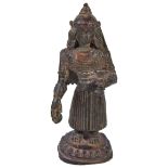 A FEMALE DEITY, NEPAL, 17TH CENTURYbronze, the figure standing on a lotus base, her body slightly