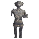 A GOND FEMALE FIGURE, ORISSA OR EASTERN DECCAN, LATE 19TH/EARLY 20TH CENTURYbronze, of stylised