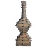 A WOOD MODEL STUPA, NEPAL, 19TH CENTURYthe stepped base with cylindrical drum with relief images