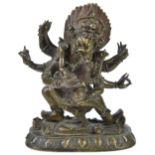 A SINO-TIBETAN BRONZE FIGURE OF MAHAKALA, CHINA, 19TH CENTURYthe six-armed tantric deity standing on