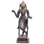 A BRONZE FIGURE OF A FEMALE DEITY, GUJARAT, WESTERN INDIA, 16TH/17TH CENTURYstanding on a square