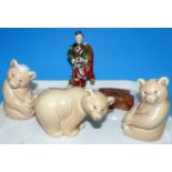 Three Poole pottery bears; a bone china figure "The Piper"; a 19th century horn covered snuff box