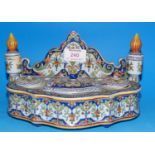 A continental Quimper style faience tin glazed pen and ink stand with 2 covered candle sconces, 2