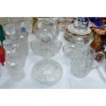 Four various cut glass decanters; 3 cut glass baskets and a jug