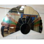 An Art Deco cloud shaped wall mirror with tinted glass panels