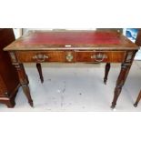 A 19th century figured mahogany writing table with inset leather writing surface, 2 frieze