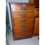 An Edwardian stained mahogany 6 height filing drawer cabinet with embossed brass handles, bearing