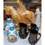A plaster figure of Lady Godiva on horseback, 19"; 3 Victorian graduating jugs; 2 continental