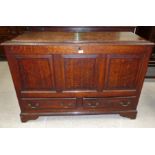 An 18th century crossbanded oak mule chest with hinged lid, triple raised panels and 2 drawers