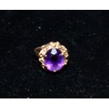 A Victorian style 9 carat hallmarked gold dress ring set with amethysts, 4.5