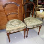 A pair of Victorian carved walnut salon chairs