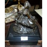 A bronze figurine of a woman on polished slate base, overall height 10"