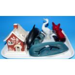 A Royal Doulton flambé ware fox; a Poole Dolphin; etc.