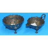 A silver cream jug and sugar bowl with embossed beaded decoration, Chester 1883, 4.3 oz