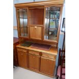 A 'Sutcliffe Furniture' teak sideboard with 3 cupboards and 3 drawers, display cabinet above with