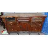 A Victorian pine dresser base with 5 drawers and central cupboard (a.f. one drawer missing)