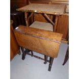 A Victorian walnut Sutherland table on turned legs; a 3 height bamboo occasional table