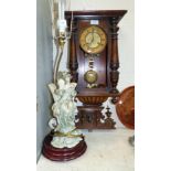 A 19th century Vienna wall clock with spring driven striking movement no glass; a Capodimonte