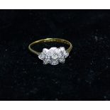 A 1930's 18 carat gold ring set chip diamonds in platinum