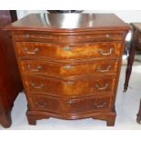 A reproduction Georgian style figured mahogany serpentine front chest of 4 drawers with brushing