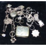 A silver sovereign case; a small silver purse; various silver jewellery; rings; etc.