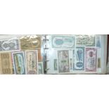 A selection of various world bank notes in an album
