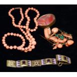 A coral and green enamel leaf brooch; a coral necklace; an enamelled and jewelled bracelet; an agate