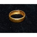 A 22 carat hallmarked gold wedding ring, 4.5 gm (cut)
