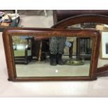 A Victorian inlaid overmantel mirror; and another