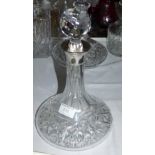 A cut glass decanter with hallmarked silver collar; a silver and ebonised box (marks worn)