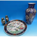 An oriental charger decorated with flowers and birds, diameter 15"; a modern Chinese blue vase (a.
