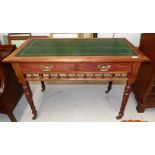 An Edwardian stained mahogany writing table with inset leather top, 2 frieze drawers, turned legs
