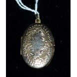 A 9 carat hallmarked gold oval locket with chased floral decoration, 4.5 gm