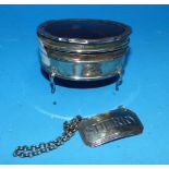 A silver oval trinket box with tortoiseshell lid, Birmingham 1920; a silver bottle label 'Sherry'