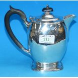 A Georgian style silver hot water jug, ovoid form on splay foot, London 1905, 14 oz