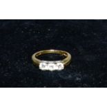 An 18 carat 3 stone diamond ring