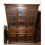 An "Old Charm" oak display cabinet with 3 leaded doors